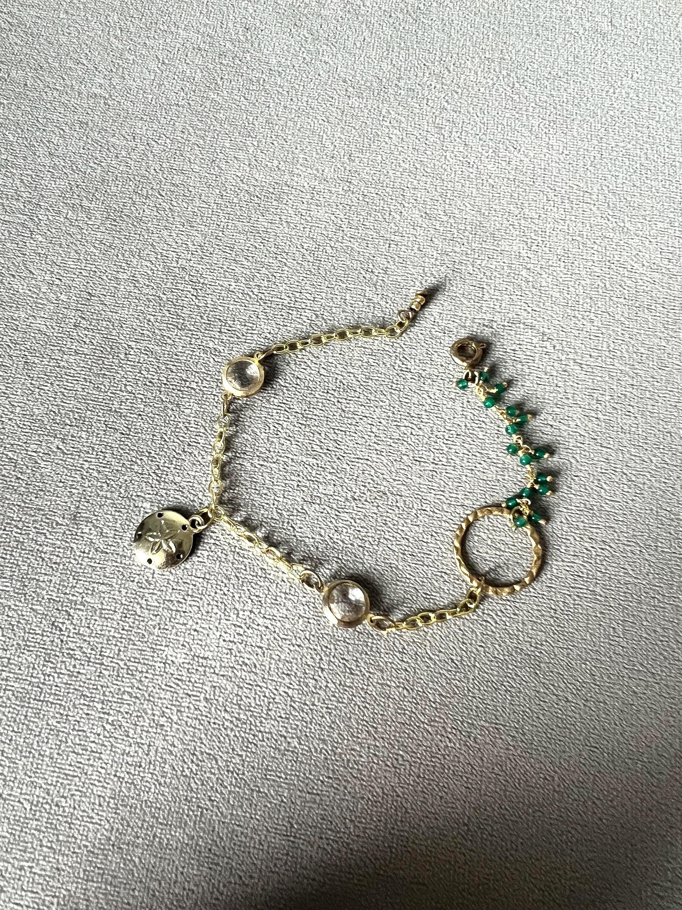 Gold Charm Bracelet with Sand Dollar & Emerald Cluster Accents