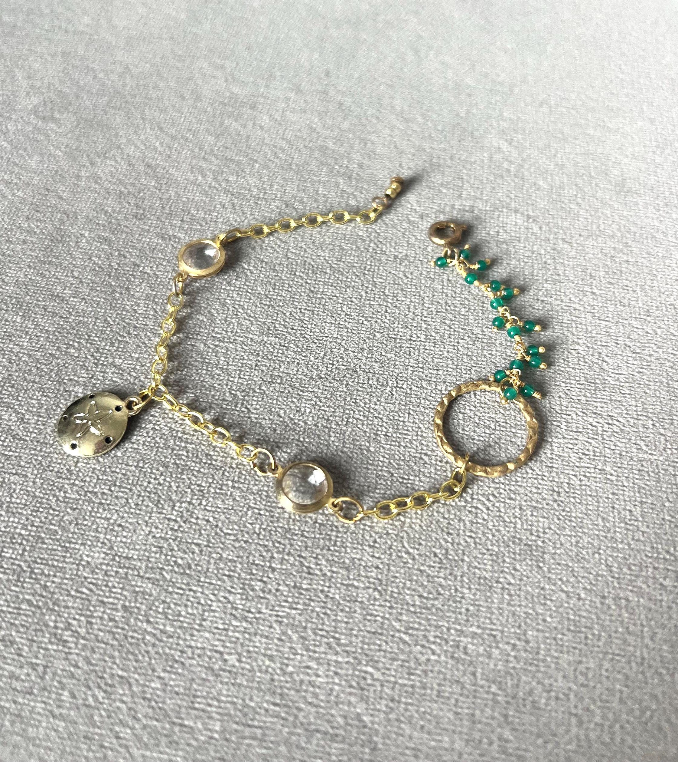 Gold Charm Bracelet with Sand Dollar & Emerald Cluster Accents