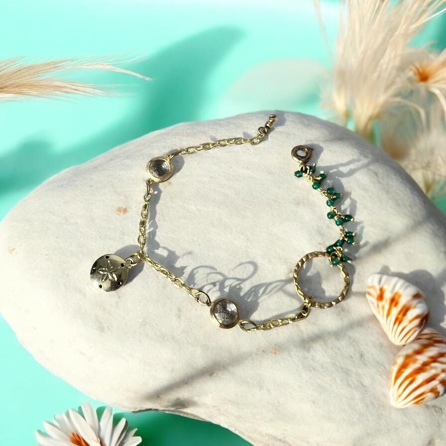 Gold Charm Bracelet with Sand Dollar & Emerald Cluster Accents
