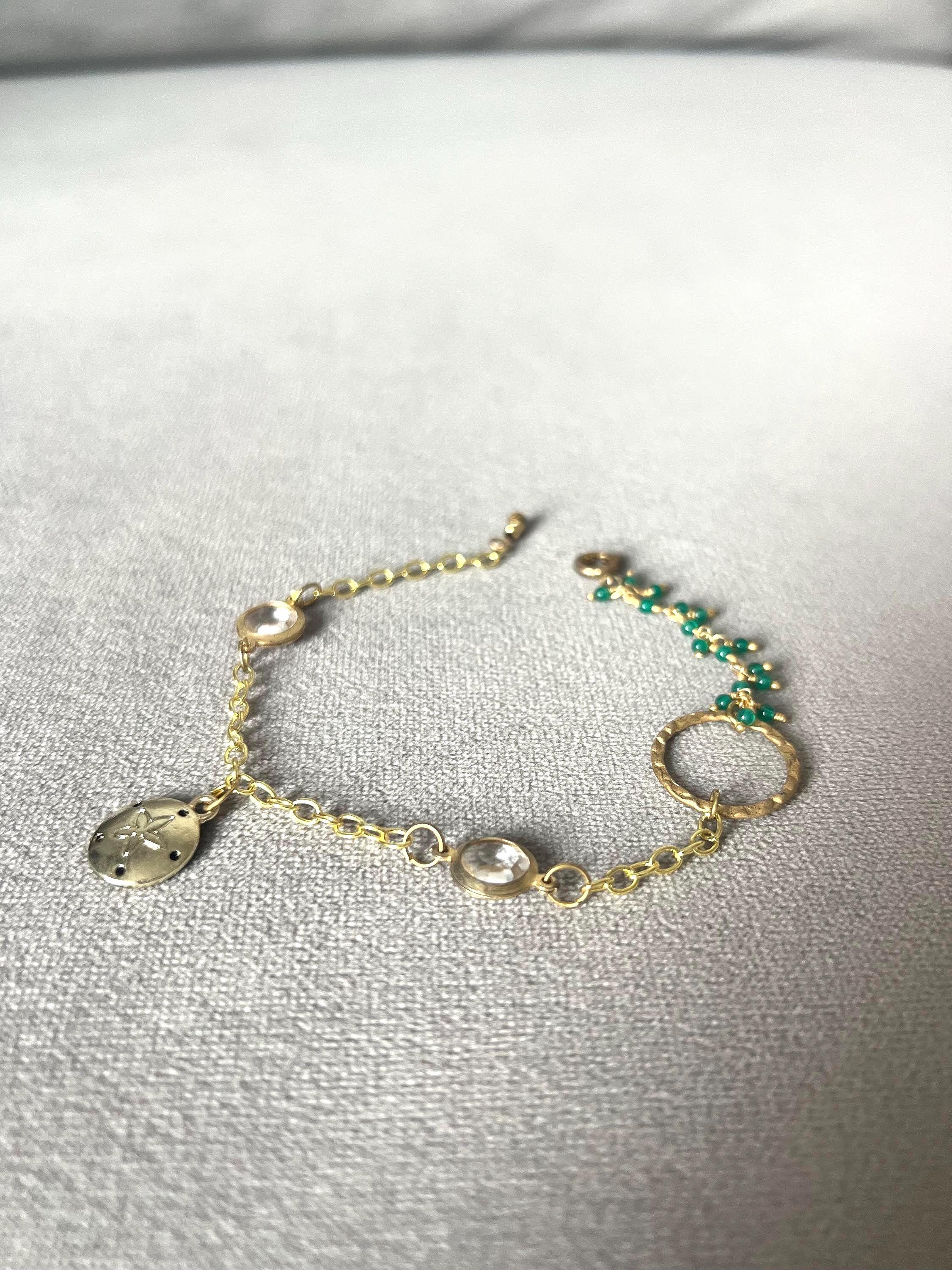 Gold Charm Bracelet with Sand Dollar & Emerald Cluster Accents