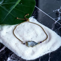 Golden Apex Quartz Bolo Bracelet — Ruby Pulse Edition